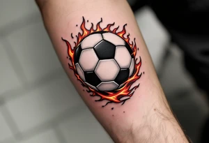 A realistic black and white soccer ball with fiery orange and red flames trailing behind it. tattoo idea