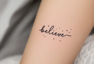 A minimalist "Believe" in black ink, with small stars in gold scattered across, symbolizing faith in one's dreams. tattoo idea