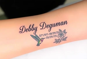 Tattoo of the name Debby Deguzman in chunky bold curly cursive with the exact dates of 08/17/61-05/29/25 surrounded by a hummingbird and a rose tattoo idea