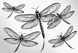 4 simple dragonflies flying together tattoo idea