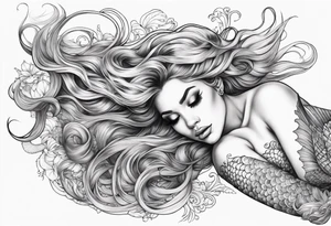 full body mermaid lying on her back with flowing hair and fan tail tattoo idea