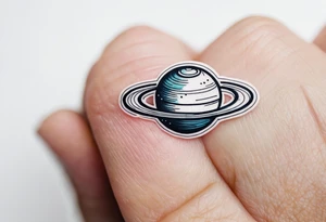 Spinning Saturn on your finger tattoo idea