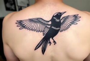 Magpie with spread wings looking over it's shoulder tattoo idea