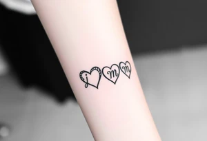 four hearts with the initials "j" "e" "m" "m" in each heart tattoo idea