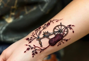 A Victorian-style spinning wheel with elegant mahogany tones, paired with a spool of deep burgundy yarn and subtle lacework details. tattoo idea