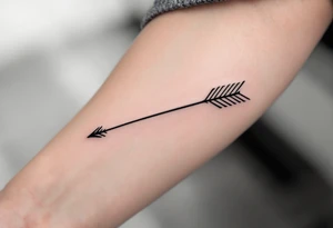 A sleek black ink arrow with a delicate gold accent running along its shaft, symbolizing elegance and direction. tattoo idea