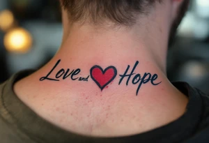 Brushstroke style tattoo in dark ink love faith hope with a crimson heart replacing the letter "o" in "love and hope". tattoo idea