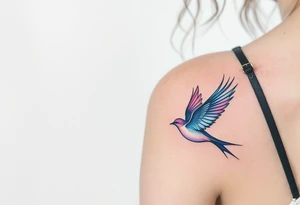 Stylized swallows in dusty rose and deep blue flying toward each other on the back shoulders signify freedom and loyalty. tattoo idea