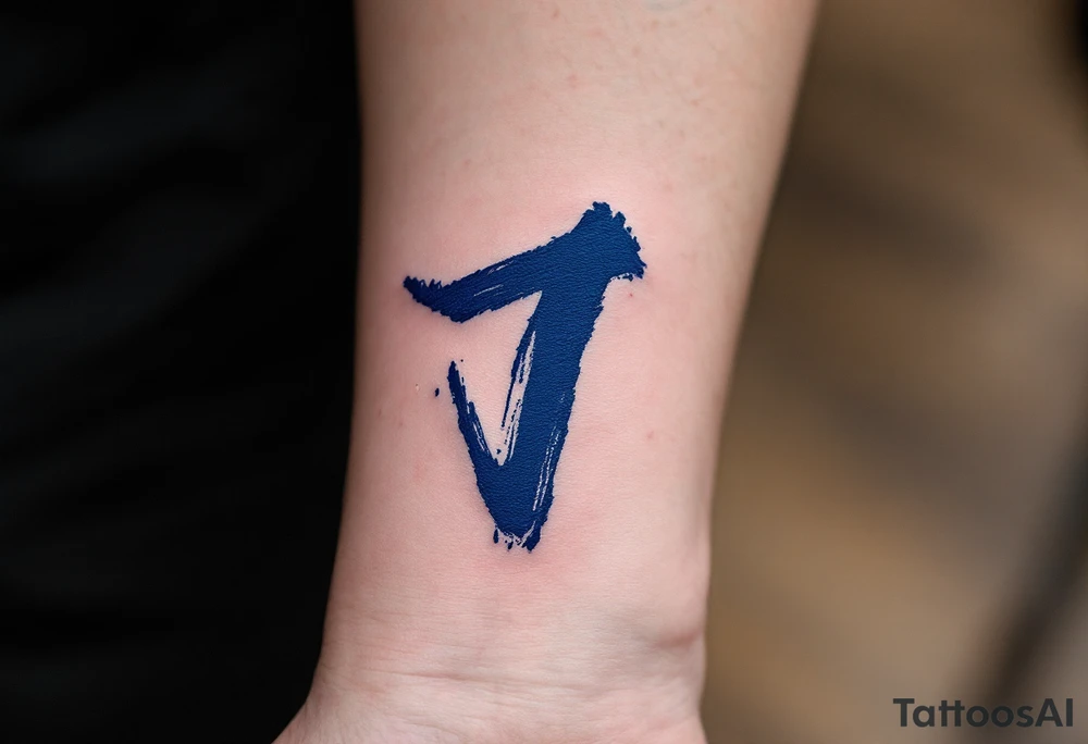 Brushstroke-style "J" in deep indigo, resembling Japanese ink calligraphy. tattoo idea