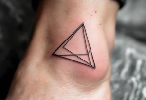 A hollow triangle made of thin silver lines, floating elegantly on the skin like jewelry. tattoo idea