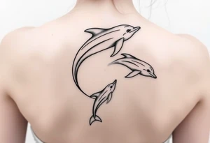 Dolphins swimming on spine tattoo idea