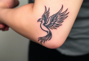 magnificent phoenix rising from golden flames with trailing embers tattoo idea