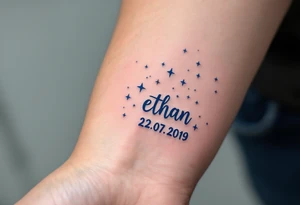 Ethan 22. 07. 2019 – Bold navy blue and silver stars scattered across a night sky, with Ethan's birthdate in a white, handwritten font. tattoo idea