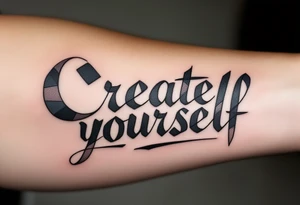 “Create yourself” in graphite black script, with geometric shapes building from the letters in cool grays tattoo idea