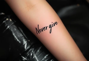 "Never give up" written in black brushstroke script with a red heartbeat line running underneath. tattoo idea