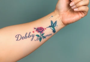 A tattoo on the forearm with the name Debby Deguzman with a humming bird and a rose tattoo idea