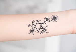 Large fine line florals that cover up an enneagram symbol tattoo idea