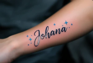 Johana scripted in a whimsical style, accented with whimsical stars in silver and light blue. tattoo idea