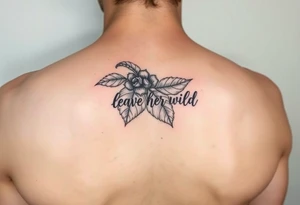 small tattoo of nightshade with words "leave her wild" on the leaves tattoo idea
