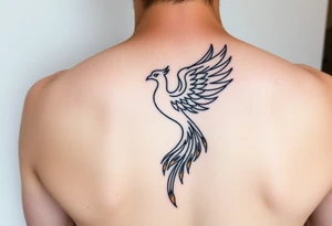 magnificent phoenix rising from golden flames with trailing embers tattoo idea