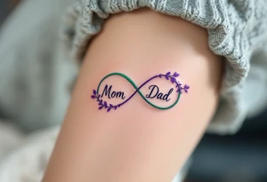 A delicate infinity symbol in violet and emerald green with “Mom  Dad” intertwined. tattoo idea