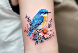 Puffy bluebird surrounded by wild flowers tattoo idea