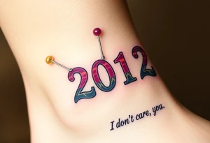 Safety pins through the skin attaching a running number with 2012 and purple and gold accents with “I don’t care, I love it” around the outside tattoo idea