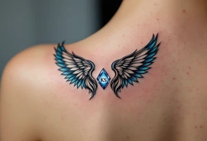 A pair of black ink wings cradling a small, blue gem with the son’s initials KS inside. tattoo idea