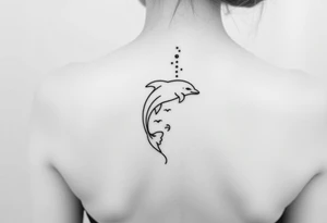 Dolphin and waves on spine tattoo idea