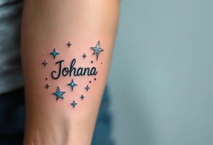 Johana scripted in a whimsical style, accented with whimsical stars in silver and light blue. tattoo idea