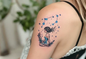 The Virgo constellation sparkles in icy blue across the back of a seated maiden in muted earth tones. tattoo idea