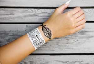 love love love love love love love connected into an armband by ivy leaves and nine hearts tattoo idea