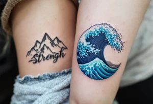 One wears a mountain range in earthy gray tones, and the other an ocean wave in blue and teal, representing strength and flow. tattoo idea
