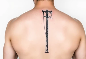 realistic tattoo of a power lineman climbing a pole tattoo idea