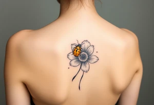 Golden or yellow ladybug on a flower small tattoo idea