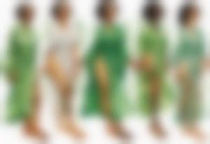 a beautiful black woman with tree roots for feet, standing with arms reaching out to the sun, wearing a sheer green robe tattoo idea