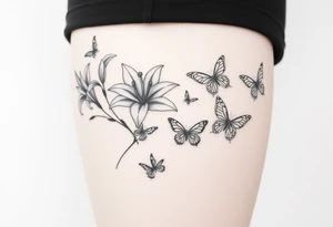 5 to 7 lily blooms in a natural stager with 2 that have petals floating off that gradually dissolve into butterflies in various stages of flight tattoo idea