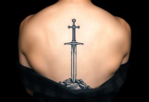 realistic sword in the ground on forearm tattoo idea