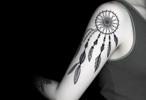 native dreamcatcher with flowing feathers and sacred beads tattoo idea