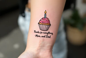 A candy-colored cupcake with a candle and the words “Thanks for Everything, Mom and Dad” in script. tattoo idea