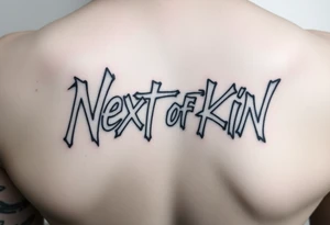 Graffiti letters of “next of kin” tattoo idea
