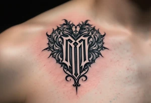 A black and grey ornamental heart with a bold Gothic-style letter "M", surrounded by subtle shading and filigree details. tattoo idea