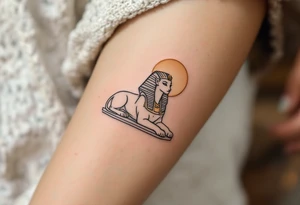 A majestic Sphinx outline in warm gray, positioned below a faded gold sun, sitting on the thigh as a guardian. tattoo idea