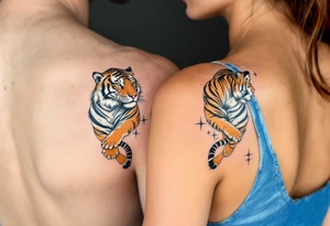 Matching couple orange and black tiger stripes wrapping around both partners upper arms tattoo idea
