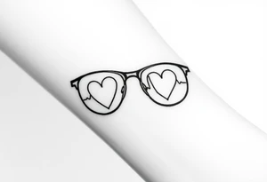 Glasses with heart lines running through them
A heartbeat-shaped line runs through the lenses of the glasses, symbolizing the importance of taking care of yourself and your eyes. tattoo idea