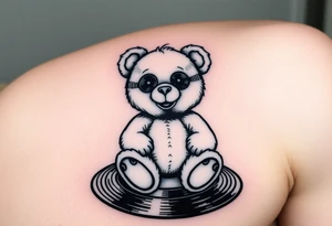 minimalist teddy bear with vinyl records as eyes smiling and sitting on a record tattoo idea