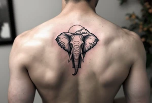 An elephant with mountains and the sunset in the background tattoo idea