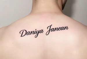 Arm tattoo with the name DANIYA JANEAN in cursive tattoo idea