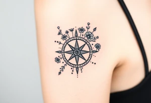 Abstract Compass with wild flowers flowing above and below the compass tattoo idea