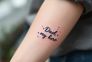 Bold black script saying “Dad, my hero” framed by navy blue stars. tattoo idea